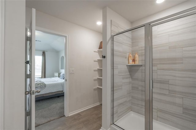 3429 Molly Dr, Yukon, OK 73099 - bathroom featuring a stall shower, wood finished floors, ensuite bath, baseboards, and recessed lighting