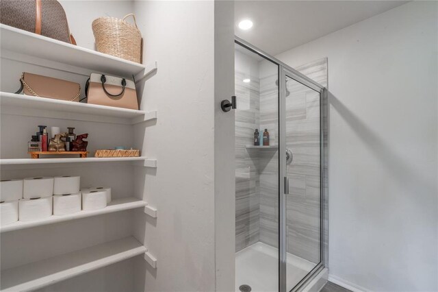 3429 Molly Dr, Yukon, OK 73099 - bathroom featuring a shower stall, baseboards, and recessed lighting