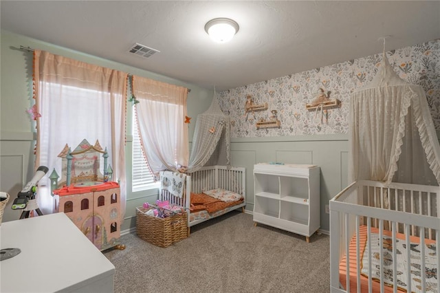 3429 Molly Dr, Yukon, OK 73099 - bedroom with wallpapered walls, wainscoting, and carpet floors
