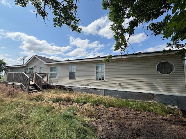 13504 E Wheat Capital Rd, Fairmont, OK 73736 - view of home's exterior with a wooden deck and crawl space