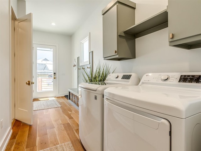80 Pistache Ln, Carlton Landing, OK 74432 - washroom with cabinet space, washing machine and dryer, light wood-type flooring, baseboards, and recessed lighting