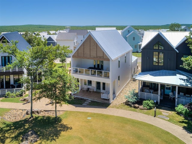 80 Pistache Ln, Carlton Landing, OK 74432 - view of front facade with a balcony, a residential view, board and batten siding, and metal roof