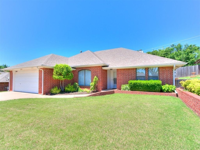 2601 Northwood Ln, Edmond, OK 73013 - ranch-style house featuring a garage, brick siding, concrete driveway, and roof with shingles