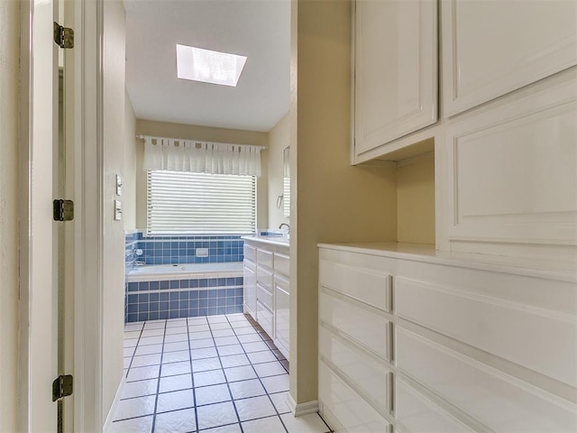 2601 Northwood Ln, Edmond, OK 73013 - full bath with a skylight, a garden tub, tile patterned floors, and vanity