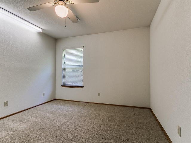 2601 Northwood Ln, Edmond, OK 73013 - unfurnished room with light colored carpet, ceiling fan, baseboards, and a textured ceiling