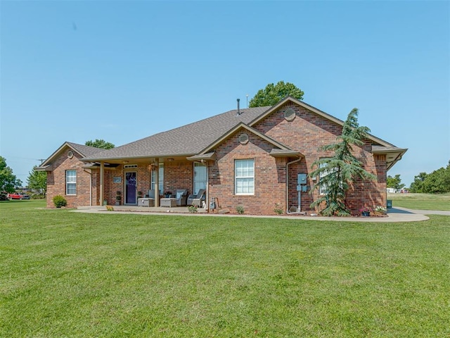 846 County St Unit 2910, Tuttle, OK 73089 - view of front facade featuring a front yard, brick siding, and a porch
