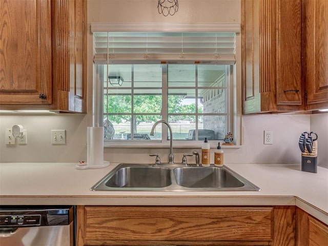 846 County St Unit 2910, Tuttle, OK 73089 - kitchen featuring dishwasher, a sink, brown cabinets, and light countertops