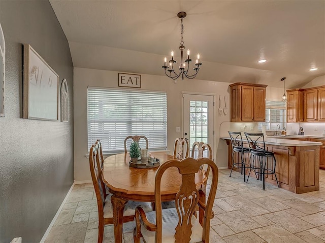 846 County St Unit 2910, Tuttle, OK 73089 - dining space featuring stone tile flooring, a chandelier, baseboards, and lofted ceiling