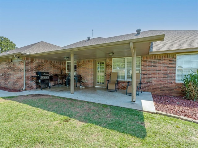 846 County St Unit 2910, Tuttle, OK 73089 - back of property with a lawn and brick siding