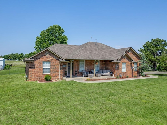 846 County St Unit 2910, Tuttle, OK 73089 - rear view of house with an outdoor living space, a yard, and brick siding