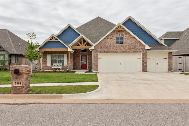 5804 NW 159th St, Edmond, OK 73013 - craftsman-style house with concrete driveway, a front yard, brick siding, a shingled roof, and an attached garage