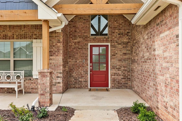 5804 NW 159th St, Edmond, OK 73013 - view of exterior entry featuring brick siding