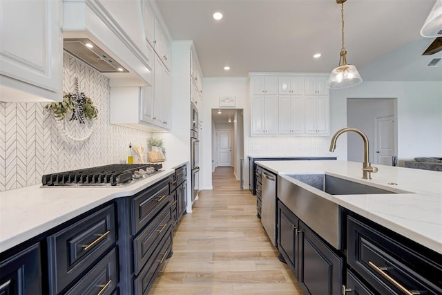 5804 NW 159th St, Edmond, OK 73013 - kitchen with custom exhaust hood, white cabinets, decorative backsplash, and recessed lighting
