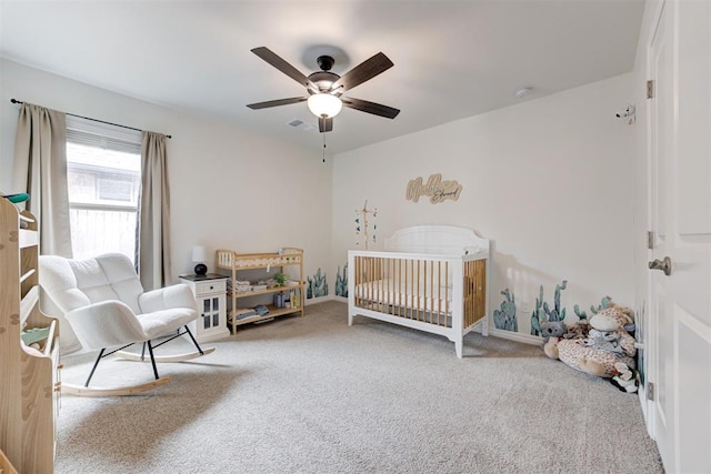 5804 NW 159th St, Edmond, OK 73013 - carpeted bedroom with a ceiling fan, a nursery area, and baseboards