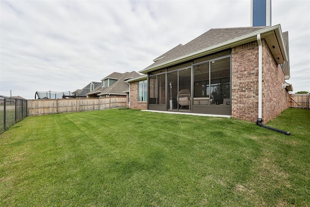 5804 NW 159th St, Edmond, OK 73013 - rear view of house with brick siding, a shingled roof, and a sunroom