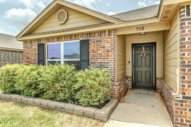 5318 Kye Dr, Tuttle, OK 73089 - property entrance with brick siding and a shingled roof