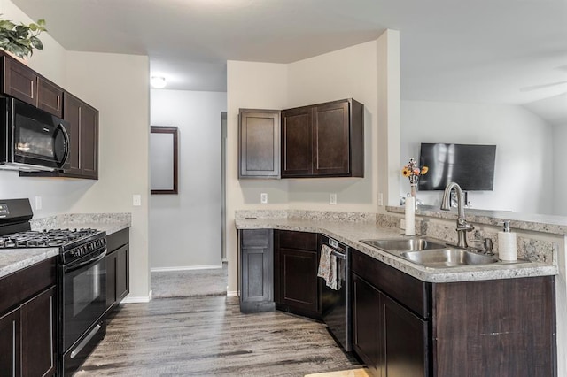 5318 Kye Dr, Tuttle, OK 73089 - kitchen featuring black appliances, a sink, light wood-style floors, a peninsula, and dark brown cabinetry