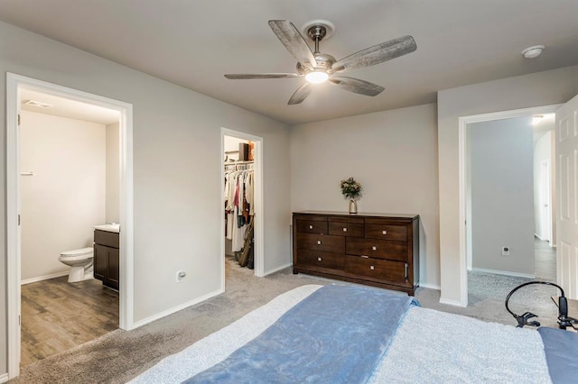 5318 Kye Dr, Tuttle, OK 73089 - bedroom with carpet, a spacious closet, baseboards, and ensuite bath