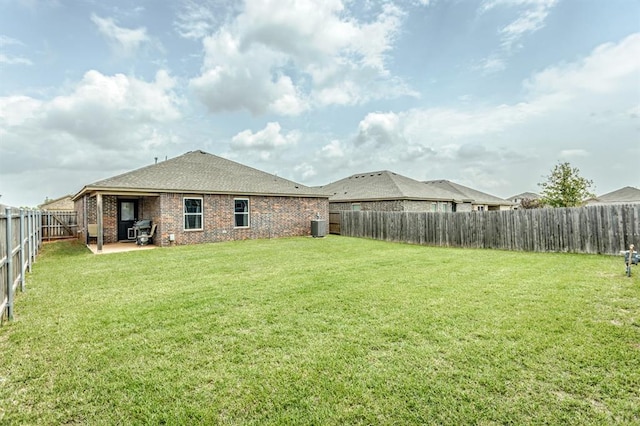 5318 Kye Dr, Tuttle, OK 73089 - view of yard featuring a patio area and central AC