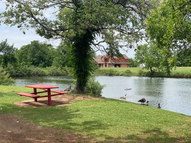9520 SW 24th Ter, Oklahoma City, OK 73128 - view of home's community with a water view and a lawn