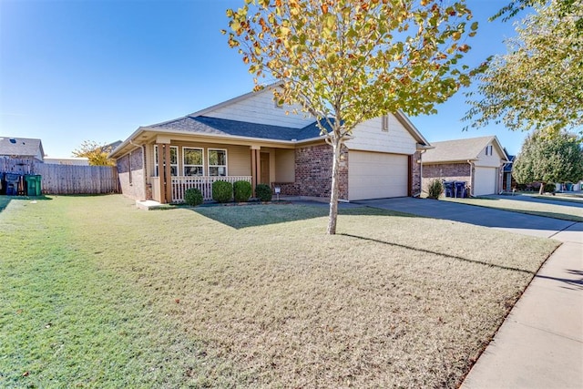 9520 SW 24th Ter, Oklahoma City, OK 73128 - traditional-style home featuring brick siding, a garage, covered porch, and driveway