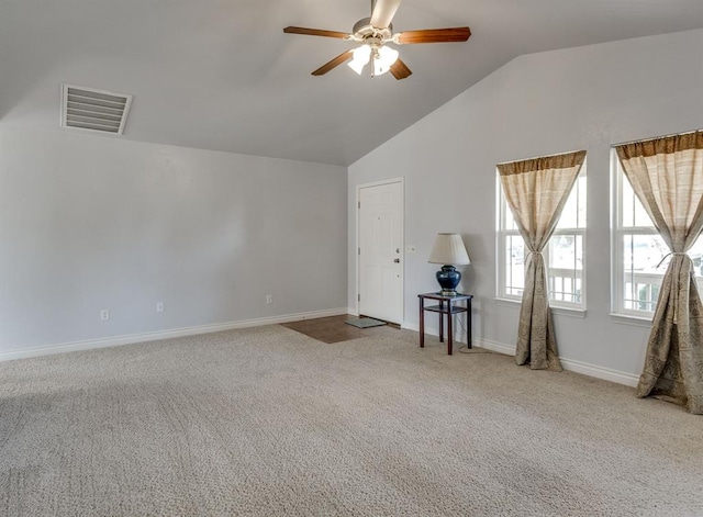 9520 SW 24th Ter, Oklahoma City, OK 73128 - carpeted spare room with vaulted ceiling, a ceiling fan, and baseboards