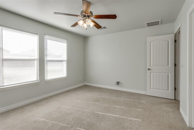 9520 SW 24th Ter, Oklahoma City, OK 73128 - unfurnished room featuring light carpet, a ceiling fan, and baseboards