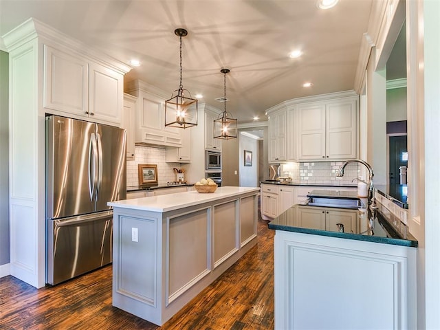 14210 Jack Rabbit Trl, Arcadia, OK 73007 - kitchen featuring appliances with stainless steel finishes, a sink, recessed lighting, backsplash, and dark wood-style flooring