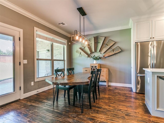 14210 Jack Rabbit Trl, Arcadia, OK 73007 - dining area featuring ornamental molding, dark wood-style floors, and baseboards