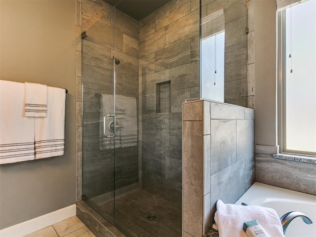 14210 Jack Rabbit Trl, Arcadia, OK 73007 - bathroom with a shower stall, a bath, and tile patterned floors