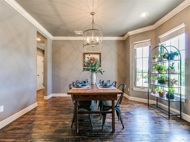 14210 Jack Rabbit Trl, Arcadia, OK 73007 - dining room featuring plenty of natural light, a chandelier, baseboards, dark wood-type flooring, and crown molding