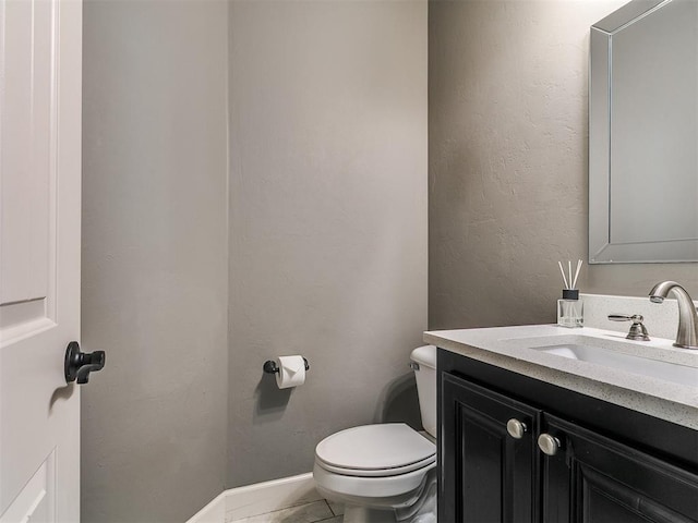 14210 Jack Rabbit Trl, Arcadia, OK 73007 - half bathroom featuring vanity, toilet, and baseboards
