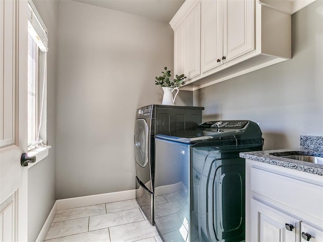 14210 Jack Rabbit Trl, Arcadia, OK 73007 - washroom with washing machine and dryer, baseboards, cabinet space, and light marble finish flooring