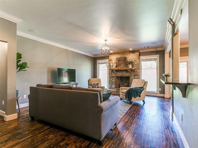 14210 Jack Rabbit Trl, Arcadia, OK 73007 - living room with healthy amount of natural light, dark wood-style flooring, a fireplace, and crown molding