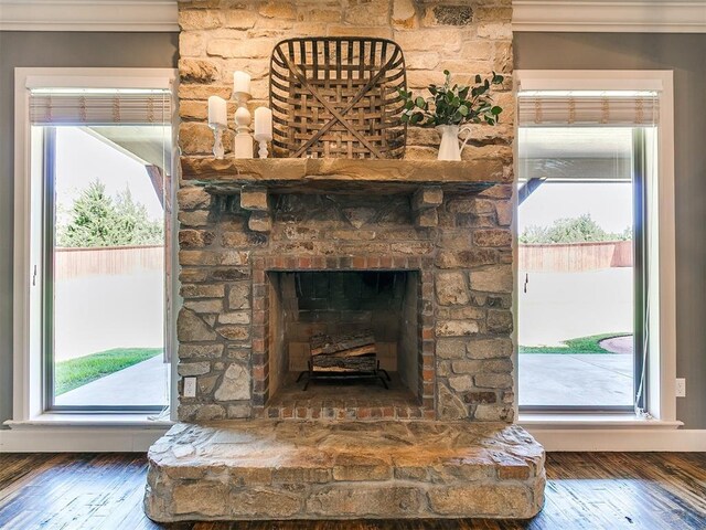14210 Jack Rabbit Trl, Arcadia, OK 73007 - detailed view of wood finished floors and a stone fireplace
