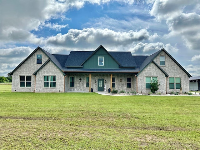 9027 Ns 3500th Rd, Prague, OK 74864 - view of front facade featuring brick siding, a front yard, and a porch