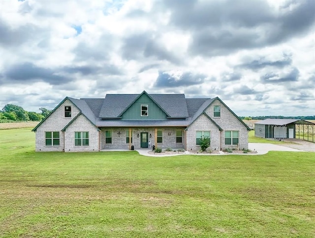 9027 Ns 3500th Rd, Prague, OK 74864 - townhome / multi-family property with a front yard, a porch, and brick siding