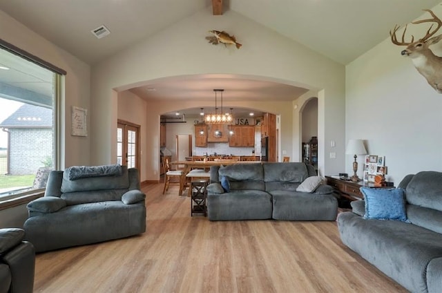 9027 Ns 3500th Rd, Prague, OK 74864 - living room with arched walkways, light wood finished floors, and french doors