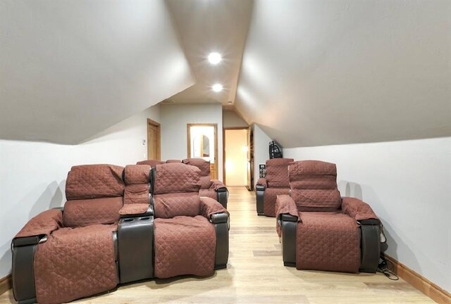 9027 Ns 3500th Rd, Prague, OK 74864 - cinema room with light wood-style flooring, vaulted ceiling, and baseboards