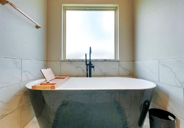 9027 Ns 3500th Rd, Prague, OK 74864 - full bath with tile walls, a freestanding tub, and plenty of natural light