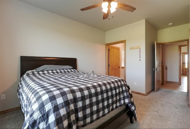 9027 Ns 3500th Rd, Prague, OK 74864 - bedroom featuring light carpet, baseboards, and ceiling fan