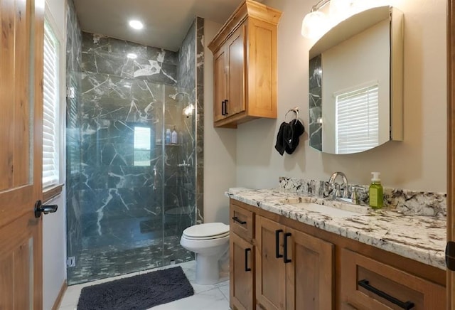 9027 Ns 3500th Rd, Prague, OK 74864 - bathroom with vanity, marble finish flooring, a marble finish shower, toilet, and healthy amount of natural light