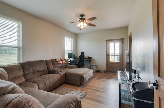 9027 Ns 3500th Rd, Prague, OK 74864 - living room featuring ceiling fan, healthy amount of natural light, a desk, and light wood-style flooring