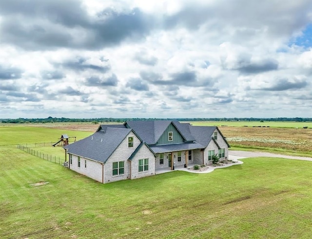 9027 Ns 3500th Rd, Prague, OK 74864 - view of front of property with a view of rural / pastoral area, brick siding, covered porch, and driveway