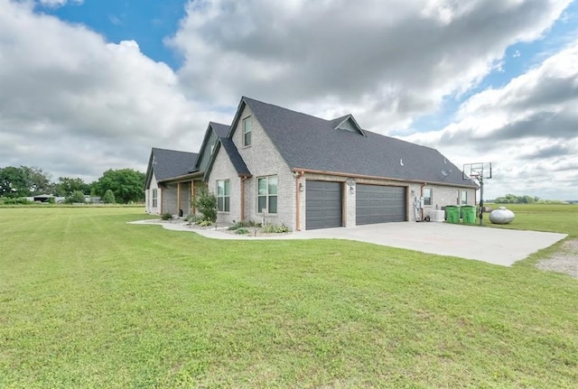 9027 Ns 3500th Rd, Prague, OK 74864 - view of side of home featuring brick siding, a garage, a lawn, driveway, and a shingled roof