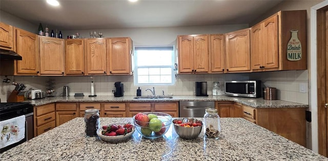 36797 N 56th Hwy, Okemah, OK 74859 - kitchen with stainless steel appliances, a sink, light stone countertops, decorative backsplash, and recessed lighting