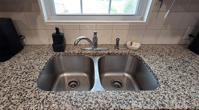 36797 N 56th Hwy, Okemah, OK 74859 - kitchen view of a sink, decorative backsplash, and stone countertops