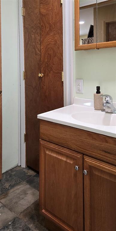 36797 N 56th Hwy, Okemah, OK 74859 - bathroom with vanity and stone finish flooring