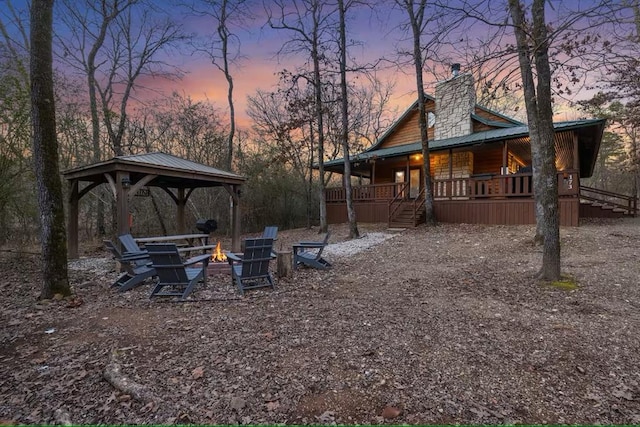 173 Alexis Ln, Broken Bow, OK 74728 - view of yard featuring a gazebo, covered porch, a fire pit, and stairs