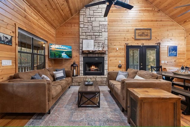 173 Alexis Ln, Broken Bow, OK 74728 - living area featuring wooden ceiling, wooden walls, a ceiling fan, french doors, and wood finished floors
